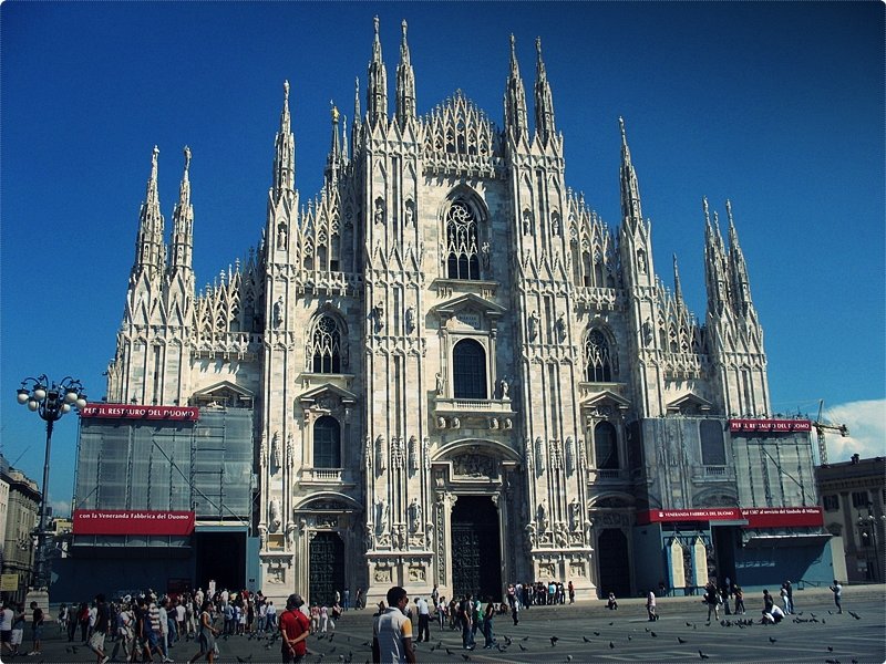 Milan Italy. Alike so many other European cities, the main attraction here is the old duomo. The Duomo, as it's called, is a massive Gothic church that was constructed beginning in the late 14th Century.
